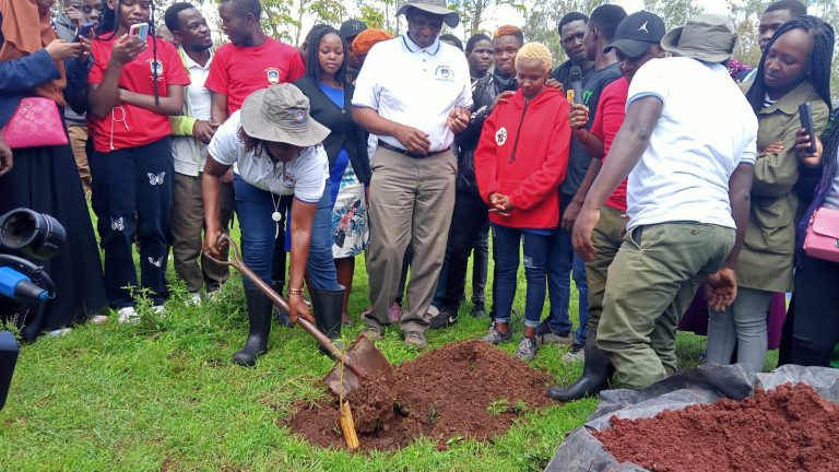MKU fraternity planting trees