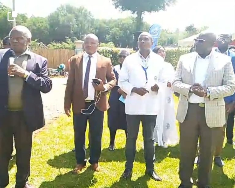 Othaya MP Wambugu Wainaina (right) listens as a Thunguri resident address locals who has turned up for the free medical camp.