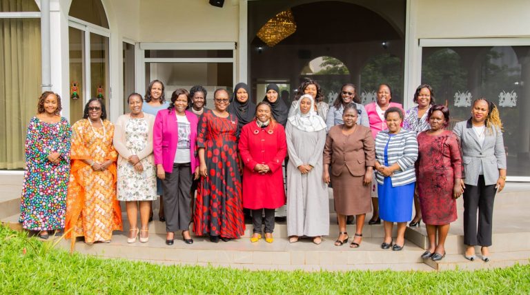Pastor Dorcas Rigathi (centre in red) takes a group picture with the county first ladies whom she hosted in Karen.