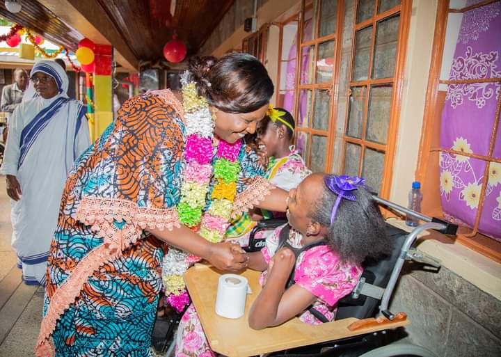 The spouse of the Deputy President Pastor Dorcas Rigathi smiles with one of the girls at the Mother Teresa Children's Home in Langata, Nairobi