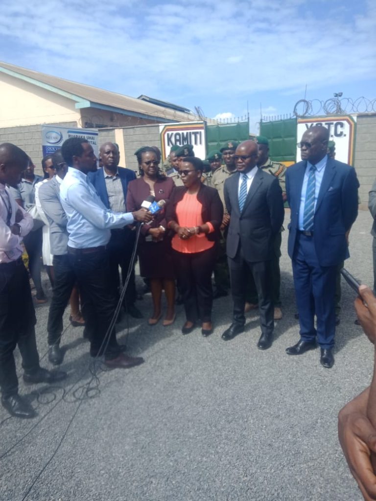 Waneni Kireri the head of the state of correctional services in Kenya addressing media next to her PS Raymond Omollo at Kamiti Youth Correctional Training Centre