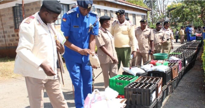 Murang'a county Security officers with some of the impounded illicit liquor