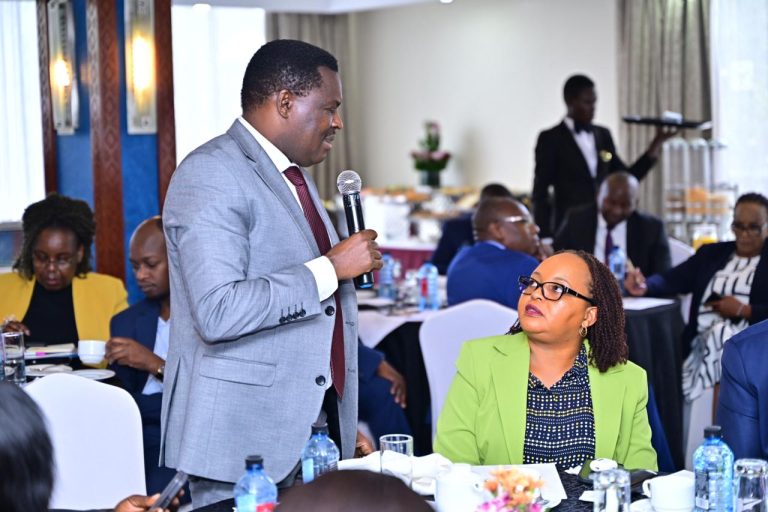 Tharaka Nithi County governor Muthomi Njuki who is also the CoG Health Committee chairperson making a point as governor Ann Waiguru looks on.