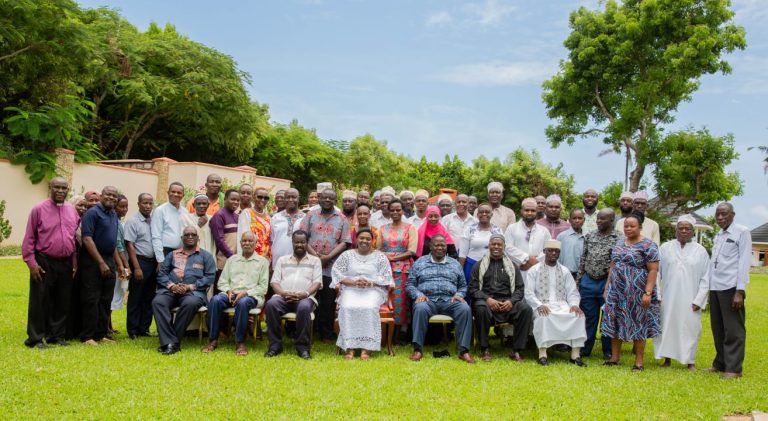 Pastor Dorcas in a group photo with the clergy who attended the clergy meeting at a Kilifi hotel