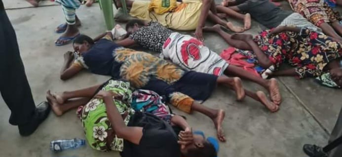 Some of the people accused alongside controversial preacher Paul Mackenzie in the Shakahola massacre case lie on the floor at the Mombasa High Court yesterday