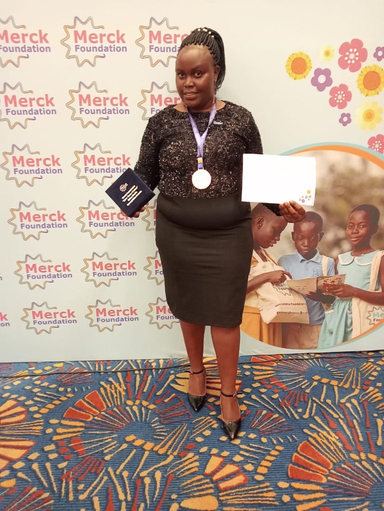 Elizabeth Angira, a multimedia journalist receiving the award