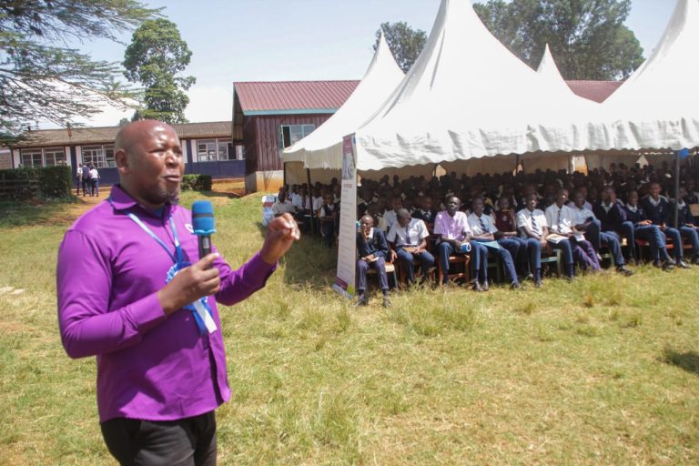 Chinga Boys alumni association chairman Alex Gathii Gitonga addressing students during the launch of counselling programme