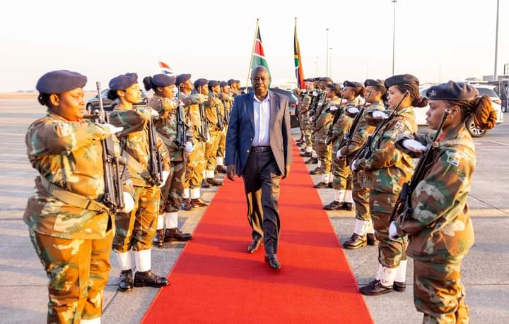 Deputy President Rigathi Gachagua passing through South African soldiers to board Kenya Airways flight to Nairobi last evening