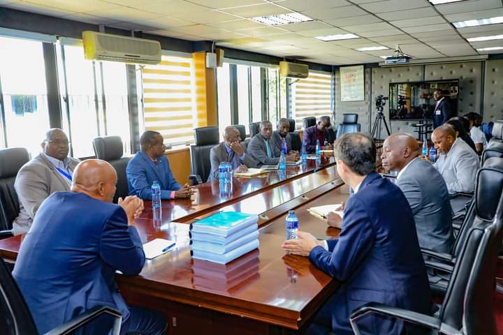 Director of Criminal Investigations Mohamed Amin with his officers and officials of the firm that is set to undertake the upgrade.