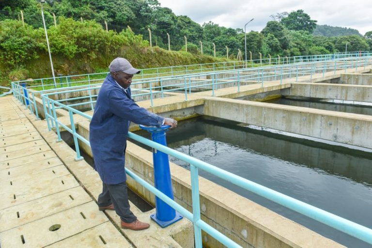 A technician test running the water systems.