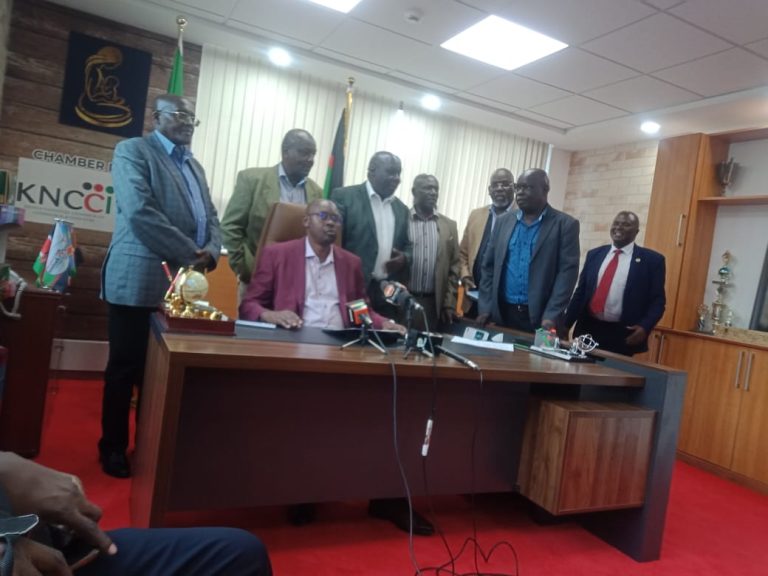 Dr.Eric Rutto adressing the Media at the KNCCI headquaters in Nairobi.