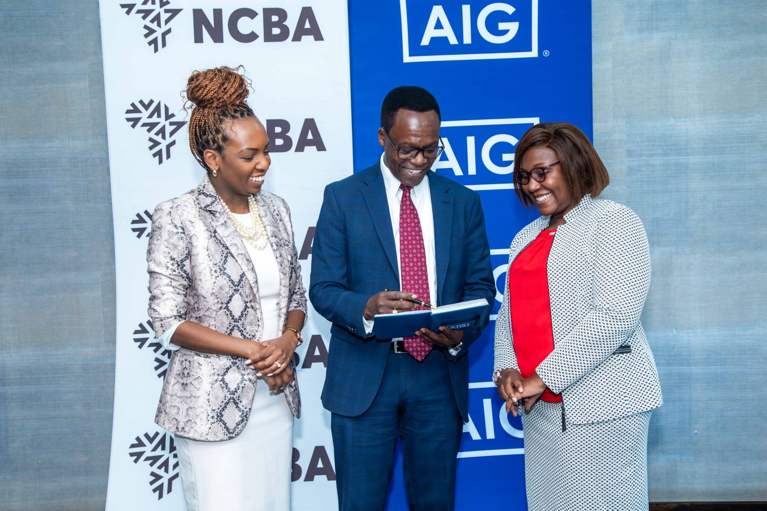 Louisa Wandabwa, Chief of Staff and Director of Strategy NCBA Group (left), John Gachora, Group Managing Director NCBA Group and Stella Njung’e MD AIG Kenya