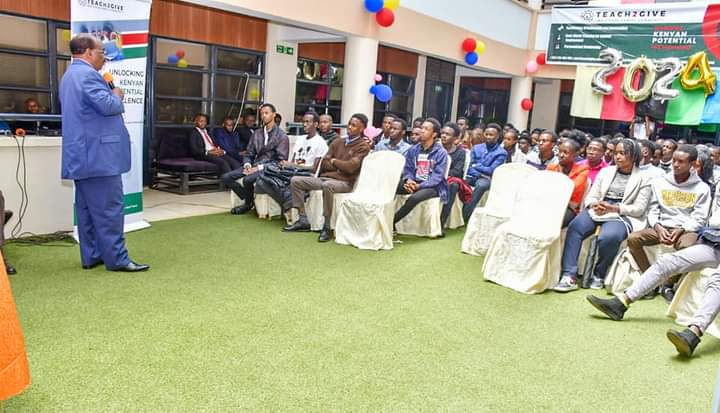Nyeri County Deputy Governor David Kinaniri addressing graduands and guests of Teach2Give initiative last week.
