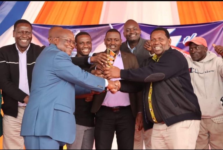 Tharaka-Nithi Deputy Governor Nyaga Muisrael (second right) receiving an award for fish farming.