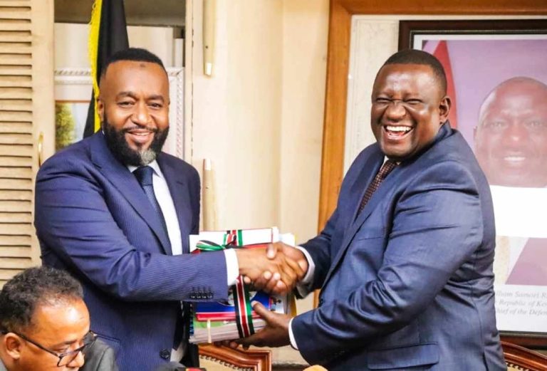 Cabinet Secretary for Investments, Trade, and industry Salim Mvurya handing over to Hassan Ali Joho the incoming Cabinet Secretary for Mining and Blue Economy