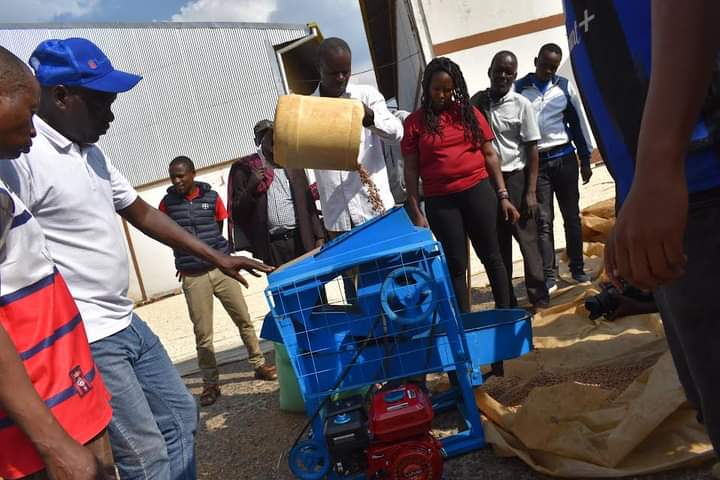 Charles Odira demonstrating how the machine works