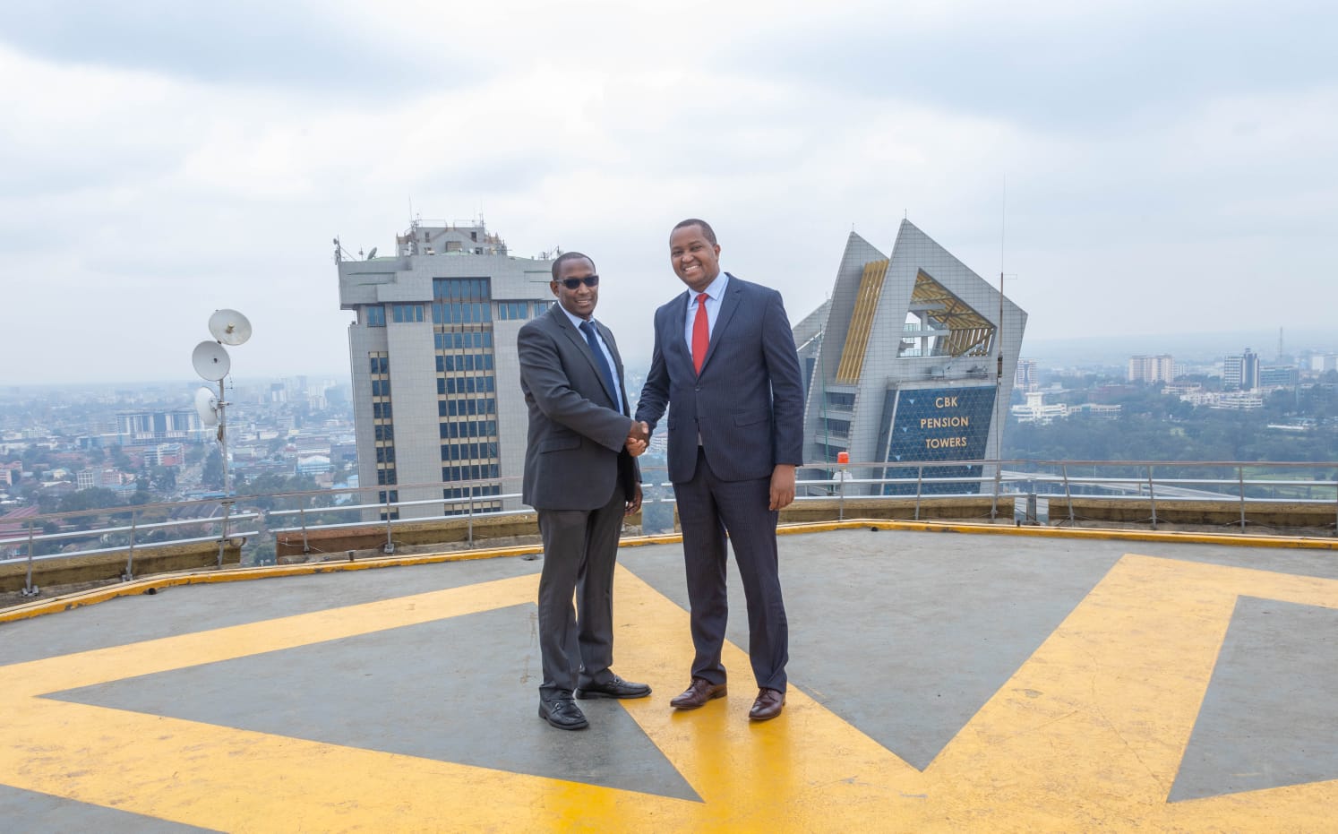 Kenyatta International Convention Centre (KICC) chairman Irungu Nyakera (right) with Chief Executive Officer atop the centre's rooftop.