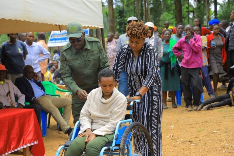 Kisii Woman Rep Dorice Donya issuing Wheelchairs and Tricycles to People Living with Disability at Nyakeya Primary South Mugirango