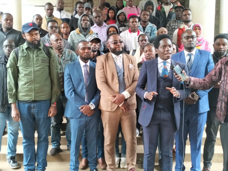 On the far left, wearing a cap, is Booker Ngesa Omole