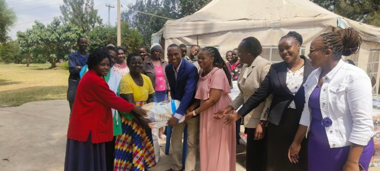 Pastor Dorcas Rigathi Foundation's Director of the Widows Program, Esther Waiganjo and other well-wishers donating relief supplies to Kibra fire victims