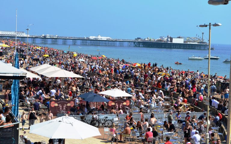 Photo 1 British holidaymakers basking in the sun in Brighton, south-east England. Holidays are back! Photo Copyright SHAMLAL PURI