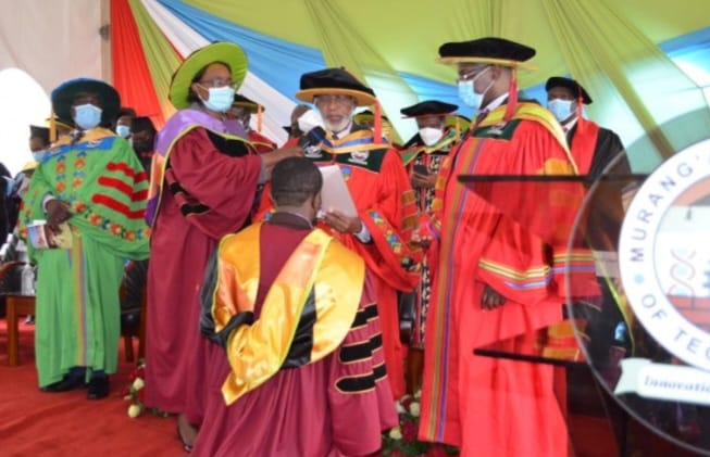 Principal Secretary of the State Department for Labour and Skills Development, Shadrack Mwadime conferring certificates during the ceremony