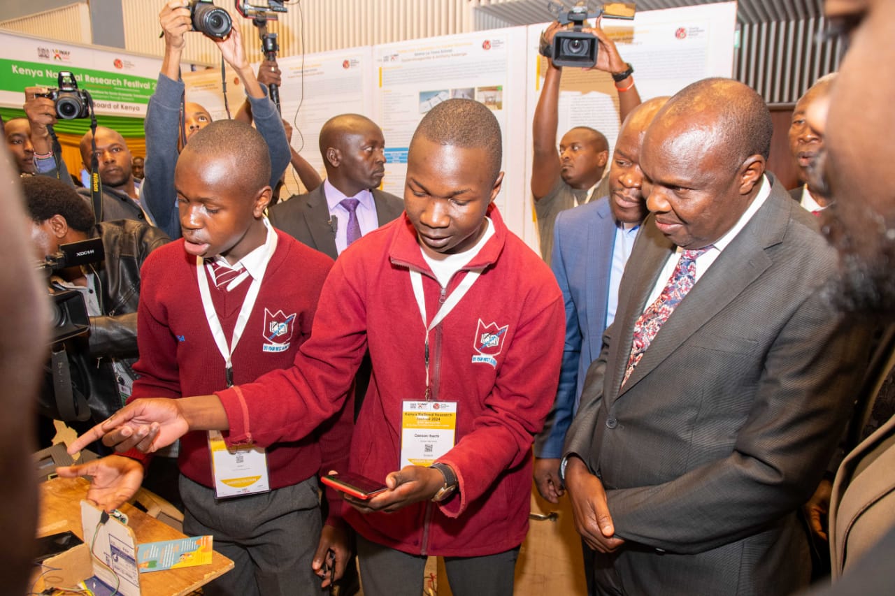 Students showcase their projects to Chief of Staff and Head of Public Service Felix Koskei at the opening ceremony of the inaugural Kenya National Research Festival at The Edge Convention Centre.
