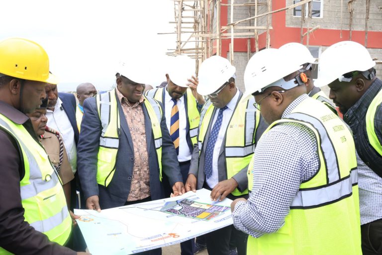 Trade CS Salim Mvurya and Investments Principal Secretary Abubakar Hassan, being shown a map by CEO Special Economic Zone Authority (SEZA) Dr. Chelule