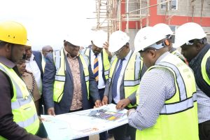 Trade CS Salim Mvurya and Investments Principal Secretary Abubakar Hassan,  being shown a map by CEO Special Economic Zone Authority (SEZA) Dr. Chelule