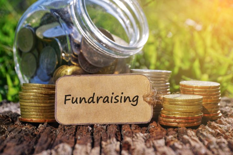 Business,Concept,-,Paper,Tag,Written,With,Fundraising,Inscription.,Coins