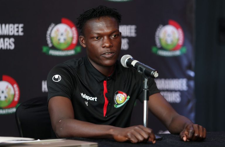 Harambee Stars player Rooney Onyango address the press.