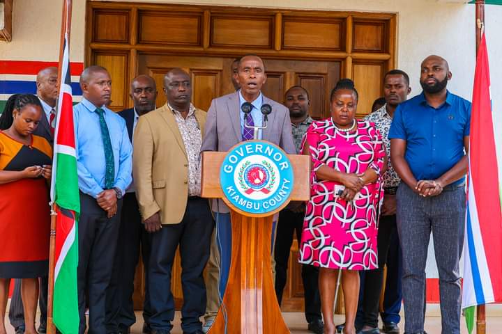 Kiambu County governor Kimani Wamatangi and other officials addressing journalists at his office.
