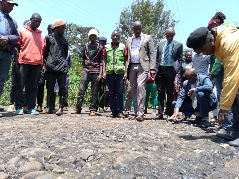 Nyeri town MP Duncan Maina Mathenge is joined by Thunguma village resident in inspecting the own going road project yesterday