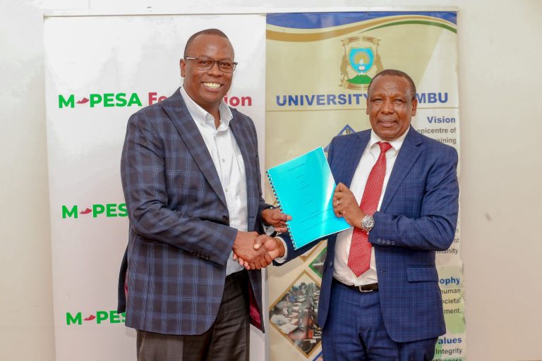 Safaricom Foundation Trustee Nicholas Kamuyu (Left) and University of Embu Vice Chancellor Prof Daniel Mugendi