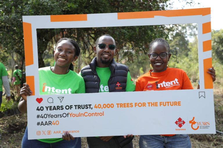 Mr Justine Kosgei, CEO of AAR Insurance – Kenya together with Lynne Okoth and Winnie Rotich (right) pose for a photo during the tree planting event at Lenana School in Nairobi