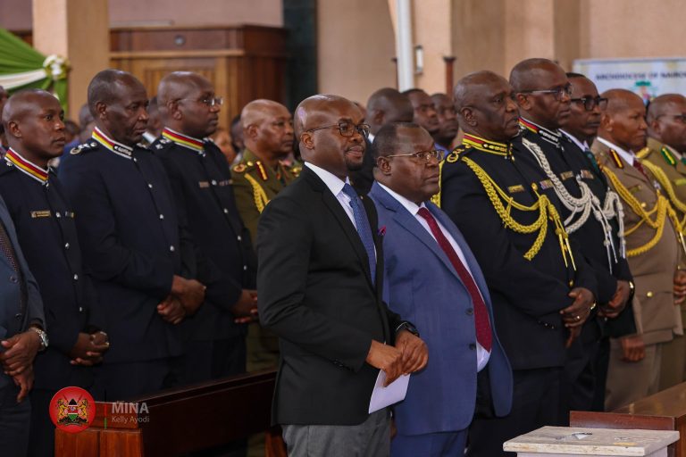 In picture is Dr. Raymond Omollo with Uniformed Disciplined Officers from the National Police Service
