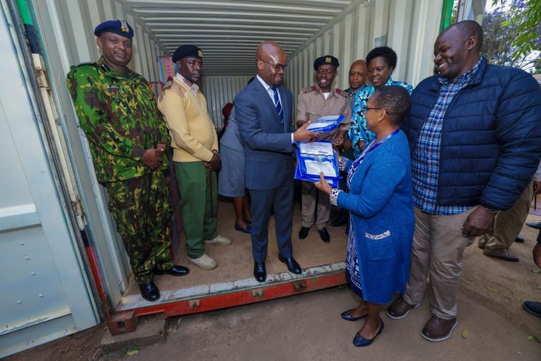 PS Raymond Omollo during the opening of the examination container at the Deputy County Commissioner’s office in Kikuyu, Kiambu County