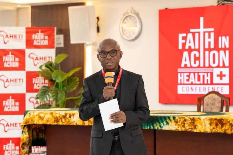 Fr. Charles Chilufya, S.J., Executive Director of AHETI, speaking during the launch of the Faith in Action Medical Conference.