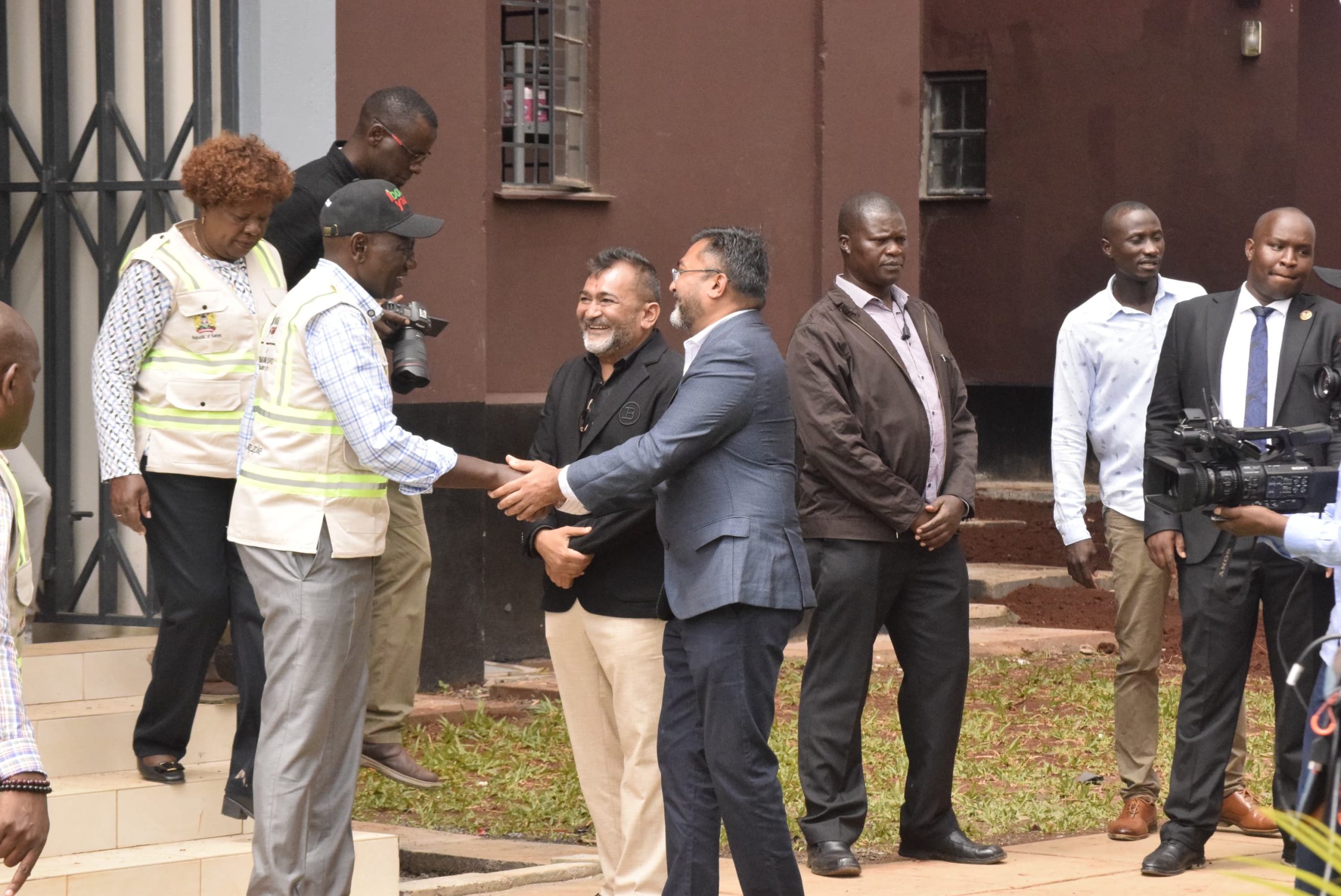 President William Ruto greets the contractor Ms Vaghjiyani Enterprises Limited Directors Mr.Ramesh Vaghjiyani