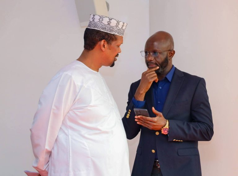 Ali Roba and Samuel Atandi in consultation during yesterday's session.