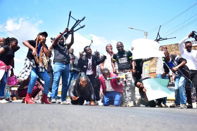 Journalist demonstrate in the streets of Nkubu town after a headteacher attacked two scribes and damaged their equipment