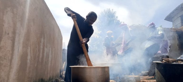 Lawyer Kiogora Mugambi stirs a sufuria of Biriani at his home in Gikumene North Imenti to mark Eid Al Adha celebrations