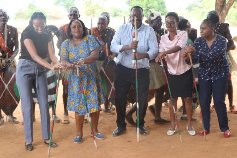 Officials from Tharaka Nithi County Government and from UNESCO join traditional dancers at Ura Gate Cultural Festival ground in Tharaka North Sub County.