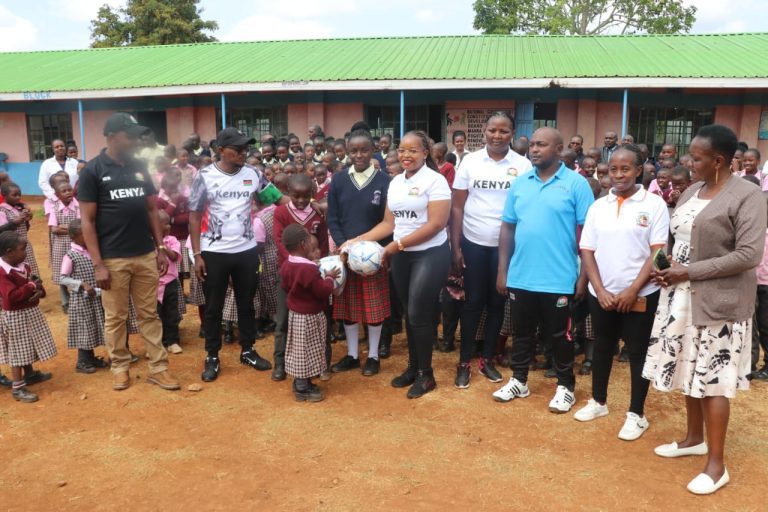 Tharaka Nithi Sport department distributing football balls to Primary School learners in an exercise aimed at nurturing sporting talents. (2)