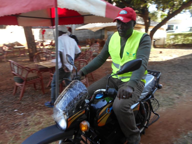 A boda boda rider testing an electric motorcycle at Ngara area in Nairobi.
