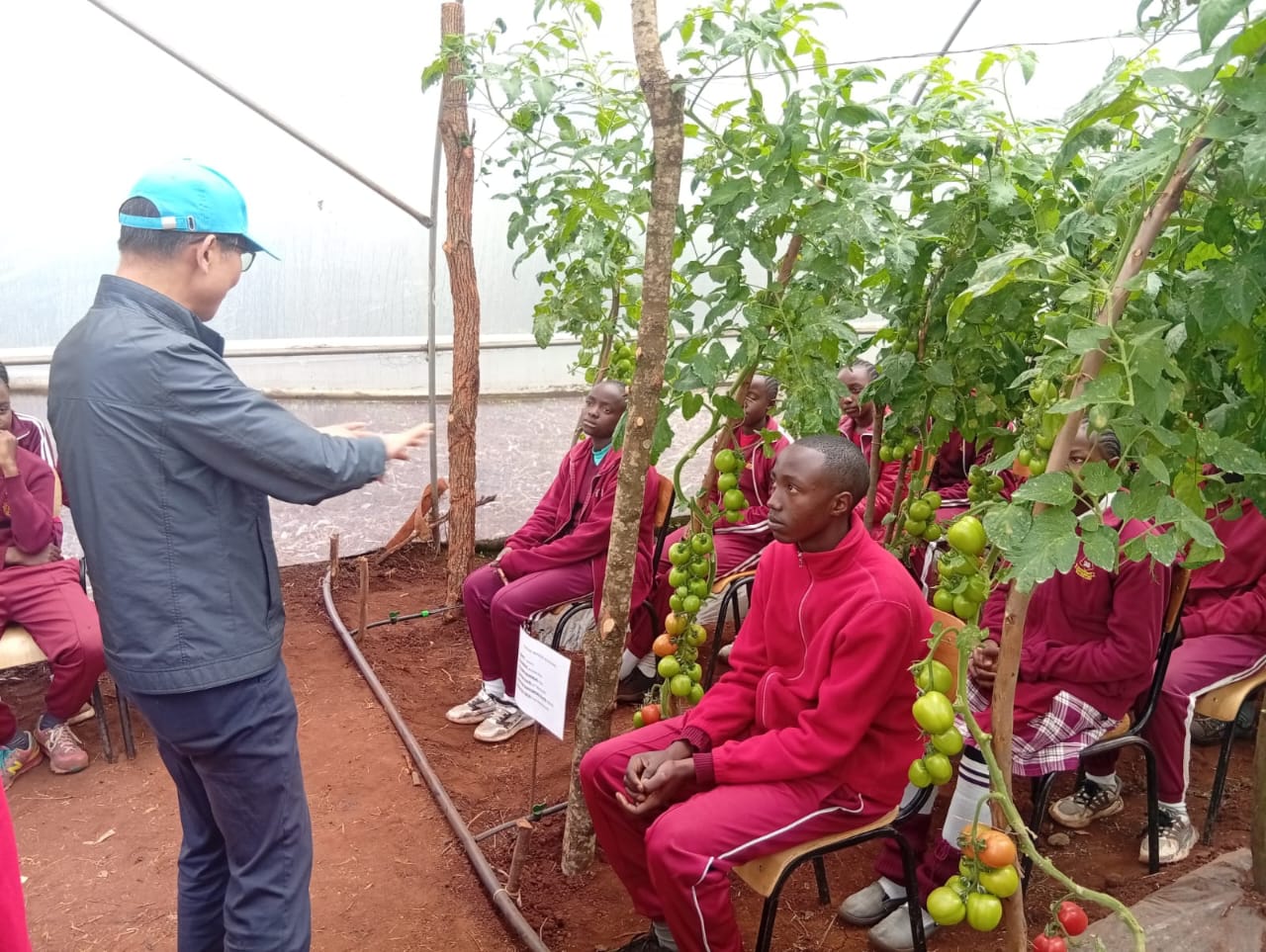 Korea Program on International Agriculture (KOPIA) Country Director Dr Ji Gang Kim while training Kandeng'wa primary school learners