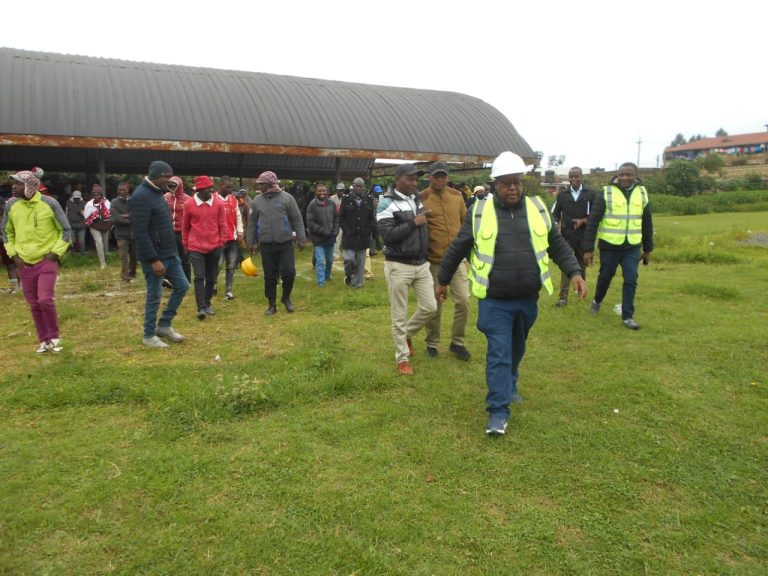 Lari MP Mburu Kahangara leads local traders at Nyambari market to the site where the modern market will be constructed