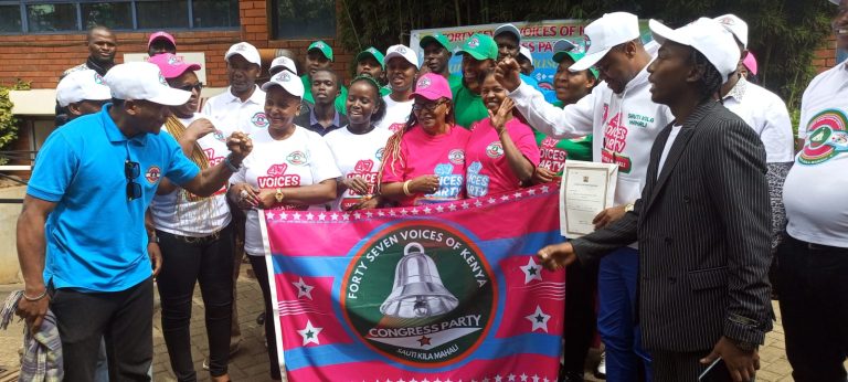 Party leader Wycliffe Kamanda and Members of 47 voices of Kenya Congress Party displays their provisional certificate