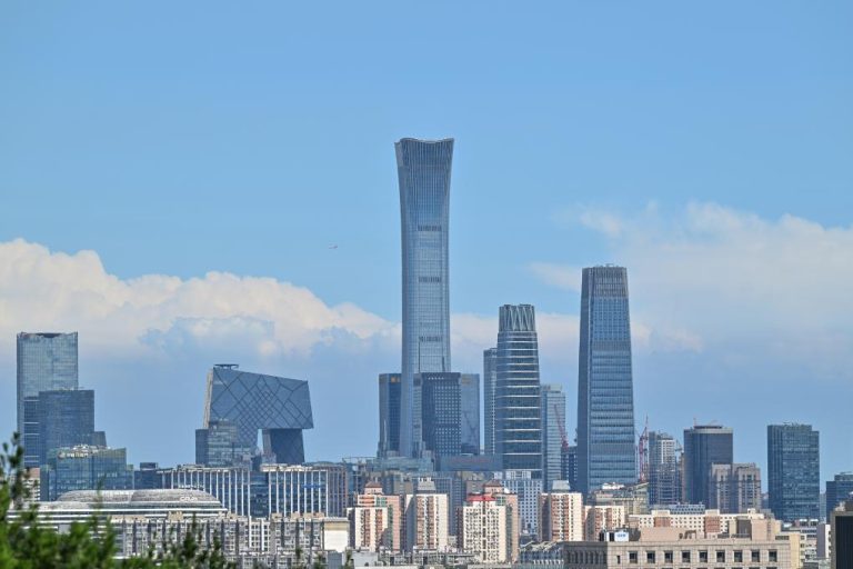 This photo taken from Jingshan Hill on Aug. 12, 2024 shows the skyscrapers of the central business district on a sunny day in Beijing