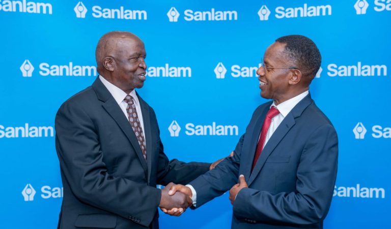 Sanlam Kenya PLC Chairman Dr John Simba (left) shares a light moment with the company's Group CEO Dr Patrick Tumbo (right) at a past event .